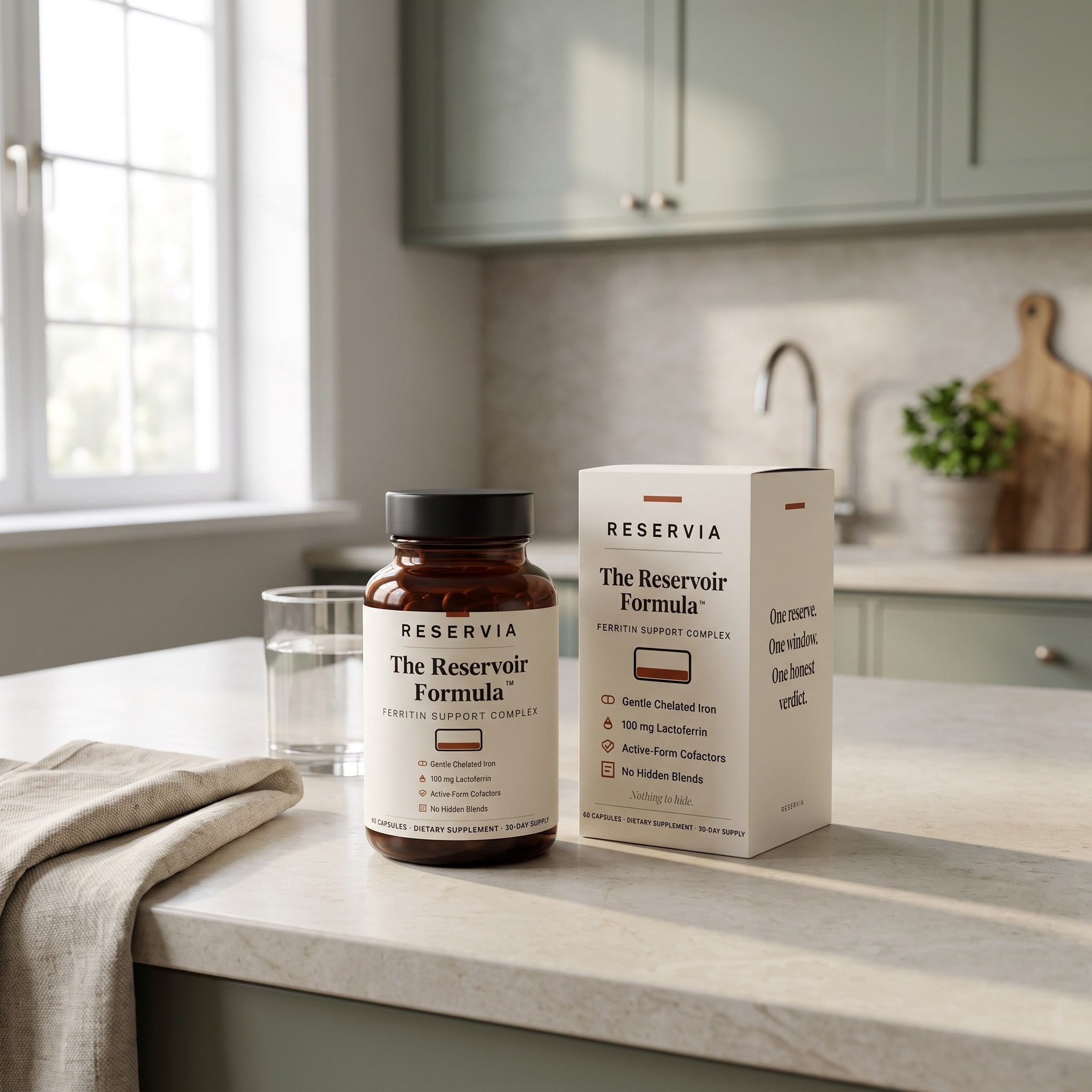 The Reservoir Formula bottle and its carton on a kitchen counter in morning light, beside a glass of water and a folded linen cloth.